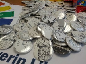 Library-related buttons made from discarded library books